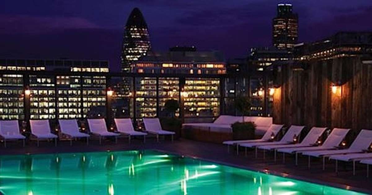 Rooftop pool at Shoreditch House with city skyline, ideal for upscale events and networking.