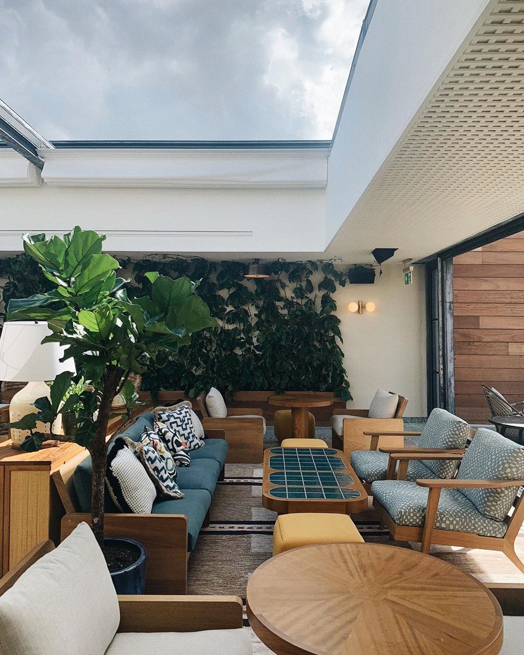 Stylish lounge area with greenery at The Back Deck, Shoreditch House for networking events.