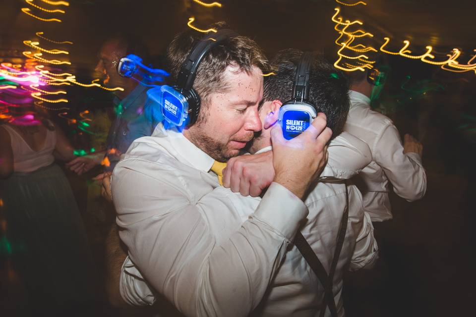 DJ booth at Silent Noize Events with vibrant lighting for a lively silent disco.