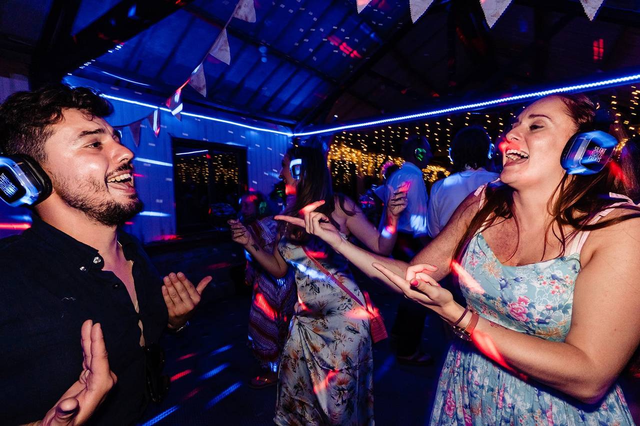 DJ booth at Silent Noize Events with colorful lighting for a vibrant silent disco.