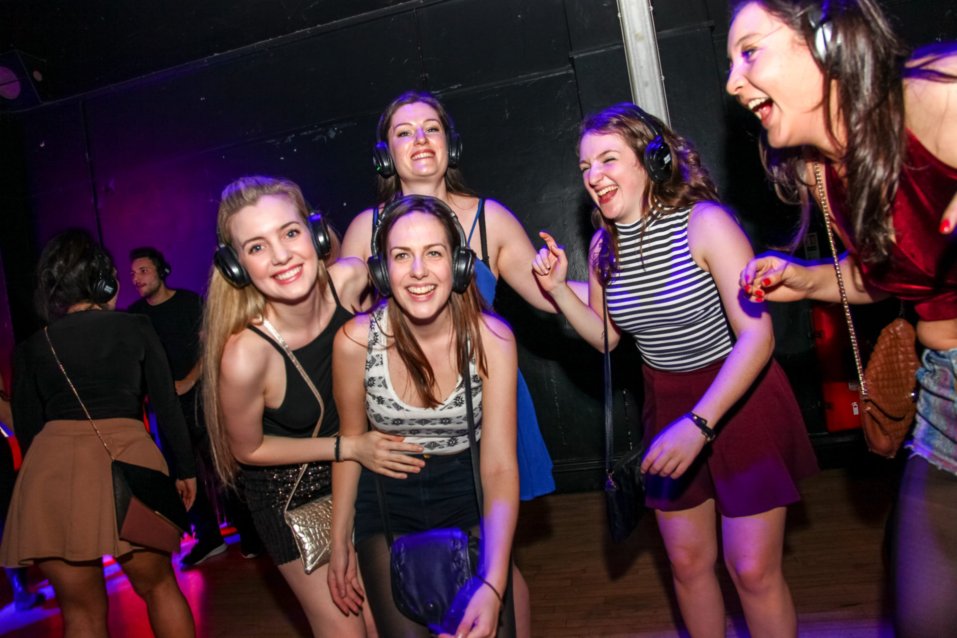 DJ booth at Silent Noize Events with attendees enjoying a vibrant silent disco experience.