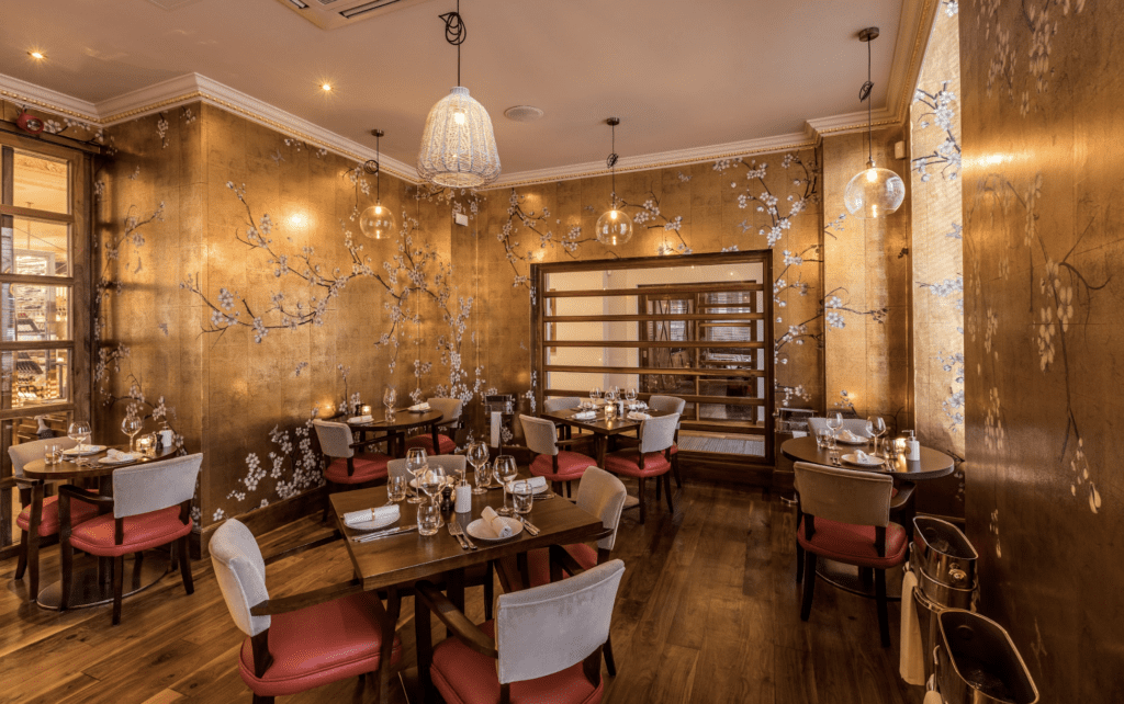 Elegant private dining space with floral decor, ideal for upscale events and gatherings.