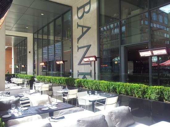 Stylish outdoor dining area at Bank Restaurant Bar & Grill, ideal for events and gatherings.