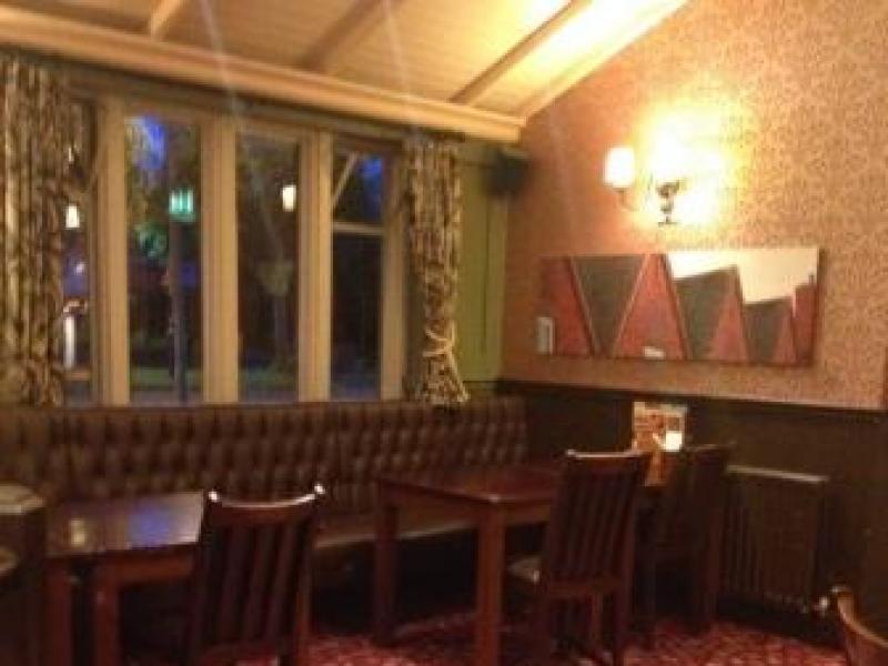 Cozy bar at The Court Oak Harborne, ideal for meetings and gatherings.