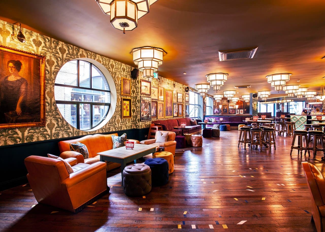 Stylish event space at Cosy Club Brindleyplace with warm lighting for gatherings and meetings.