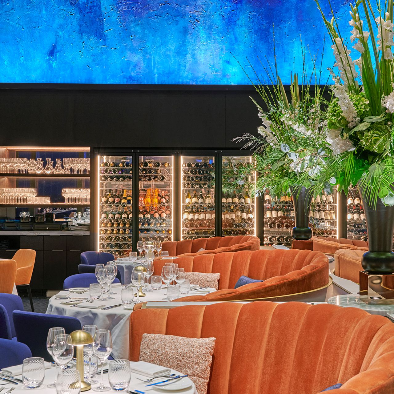 Sophisticated outdoor terrace dining space with plush seating for upscale events.