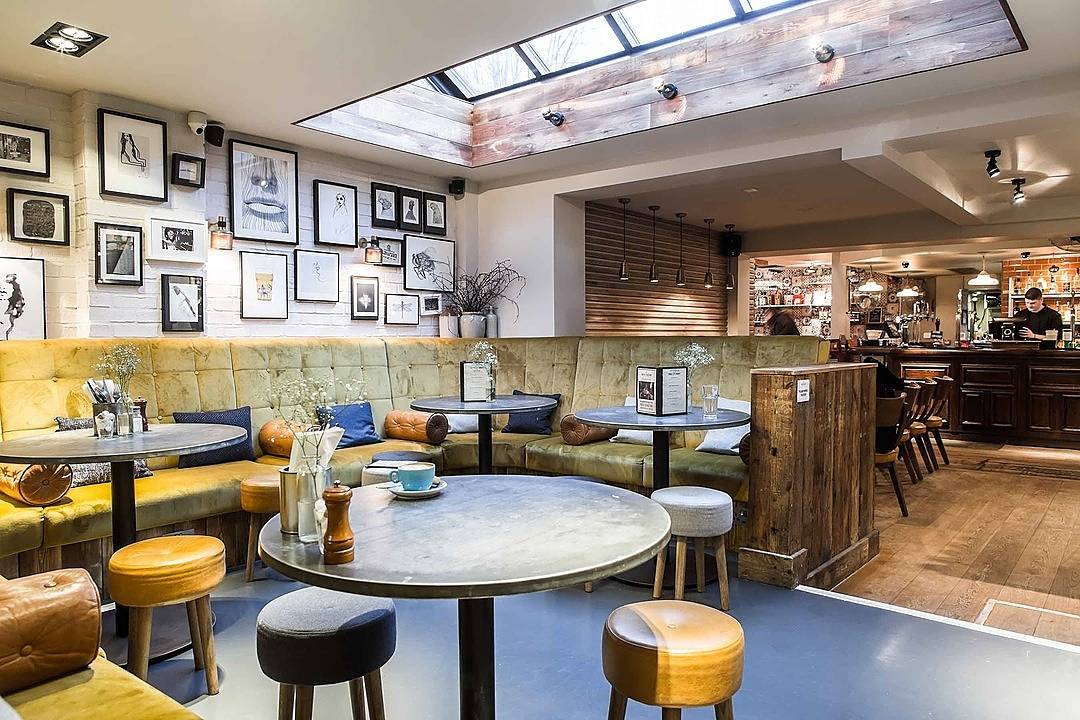 Stylish restaurant venue with cozy seating, ideal for meetings and casual events.