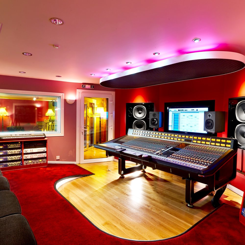 Modern recording studio with vibrant colors for creative workshops and music events.