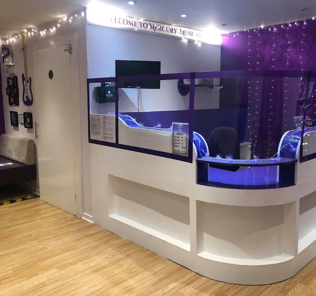 Modern reception area with purple accents for meetings and events at CapsaArx Studios.