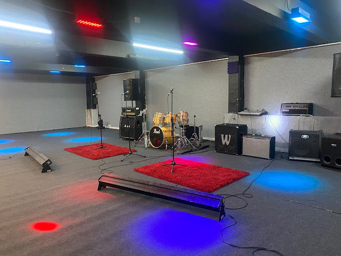 Control Room at Robannas Studios with drum set, ideal for concerts and corporate events.