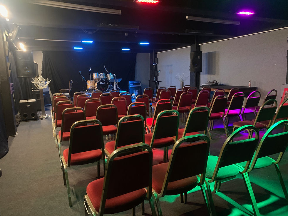 Dance Room at Robannas Studios with red chairs for concerts and performances.
