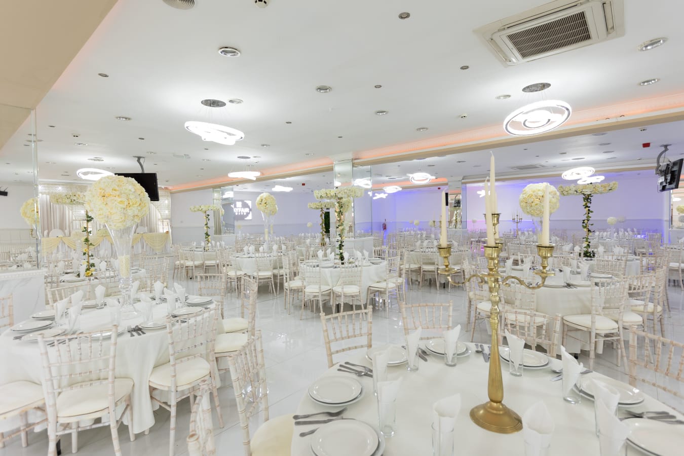 Elegant Mayfair Suite with white decor, ideal for weddings and corporate events.