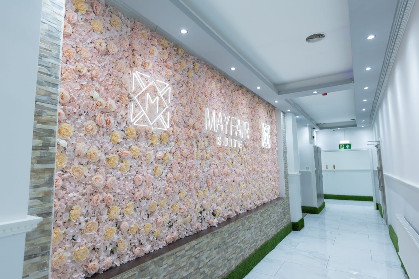 Floral wall backdrop in Mayfair Suite, perfect for upscale events and branding.