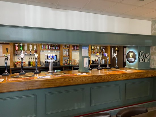 Social club bar in Greenland's Inn, ideal for networking events and social gatherings.