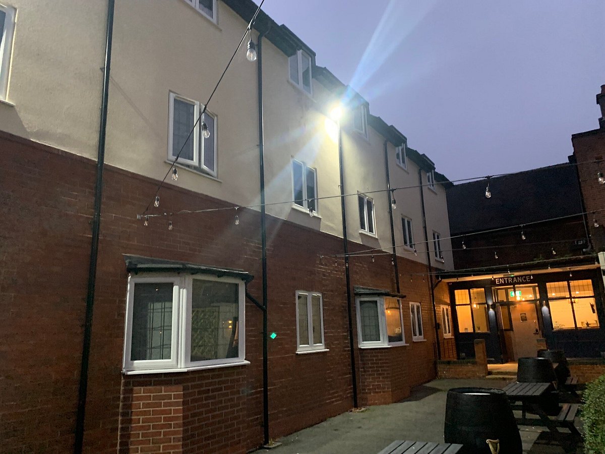 Cozy outdoor restaurant space with string lights for informal gatherings and networking events.