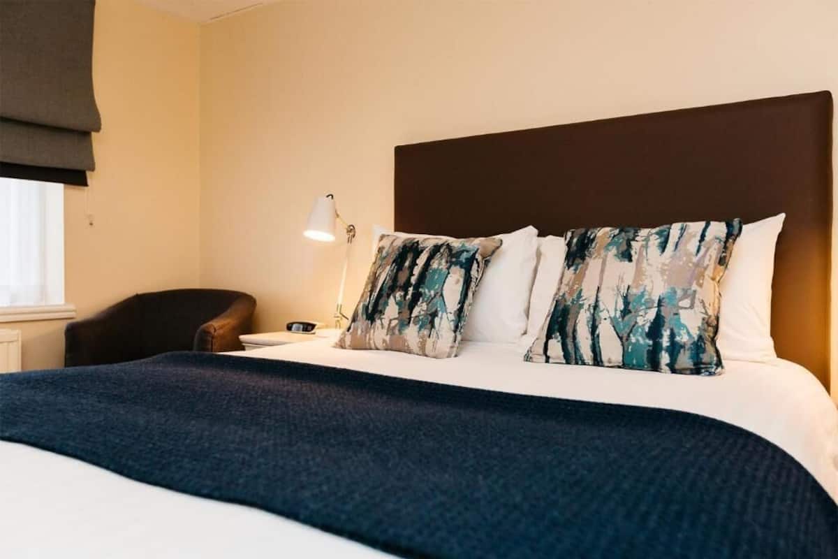 Comfortable hotel room in Peter Scott House, ideal for event attendees and conferences.