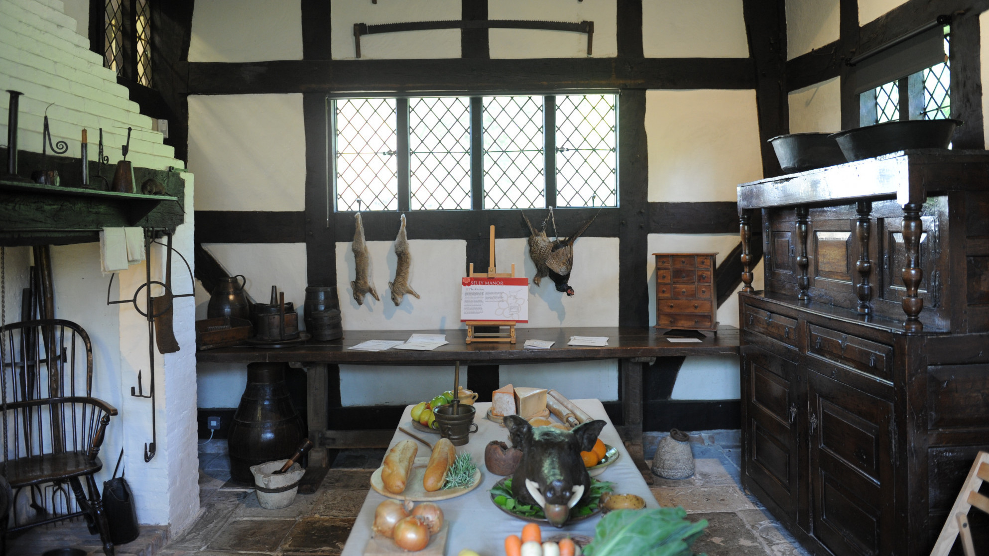 Rustic kitchen at Selly Manor Museum, ideal for culinary workshops and themed dinners.