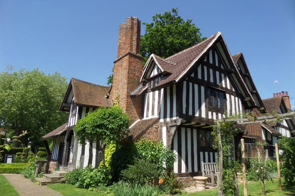 Historic Selly Manor Museum's Rest House with timber framing, ideal for weddings and events.