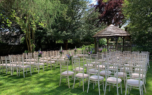 Historic Flagged Hall outdoor wedding venue with gazebo and lush greenery.