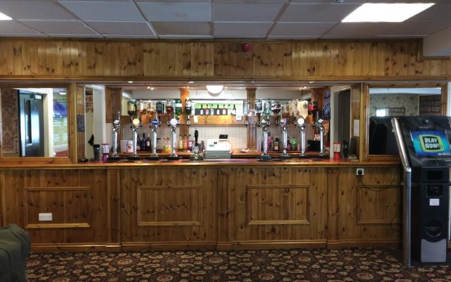 Function Room bar at Avenue Club, featuring wooden paneling for networking events.