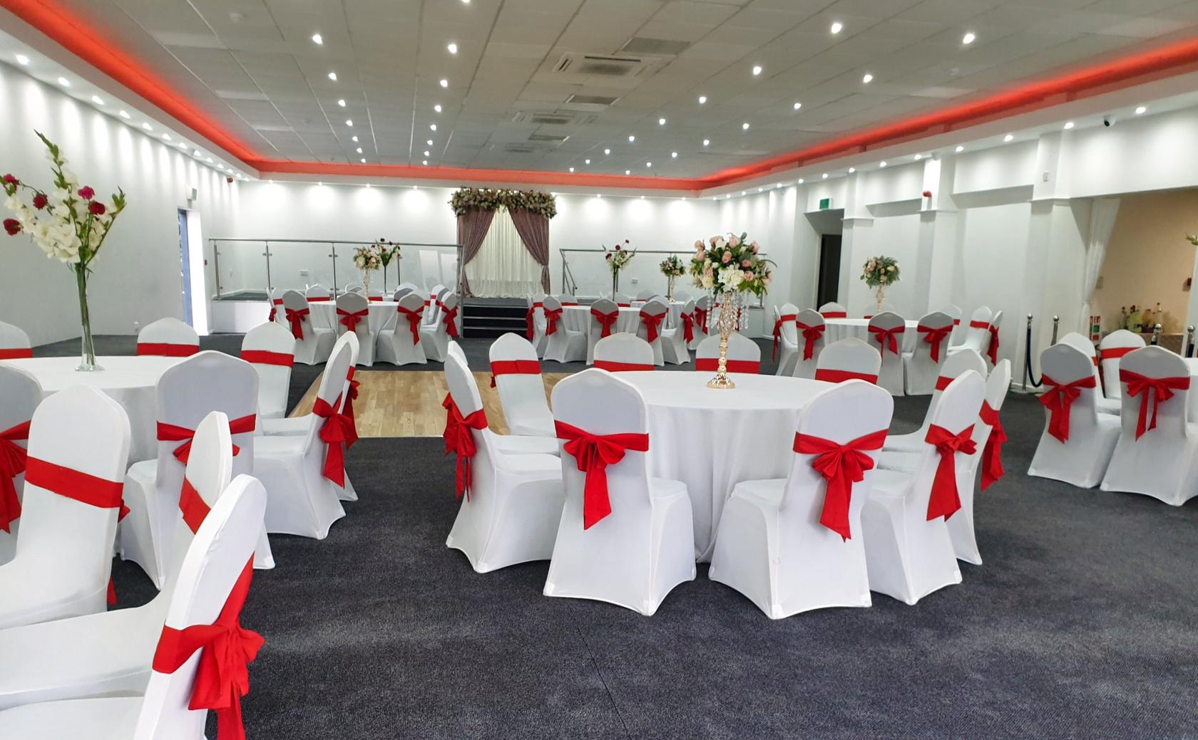 Elegant Banqueting Hall with round tables, perfect for weddings and corporate events.