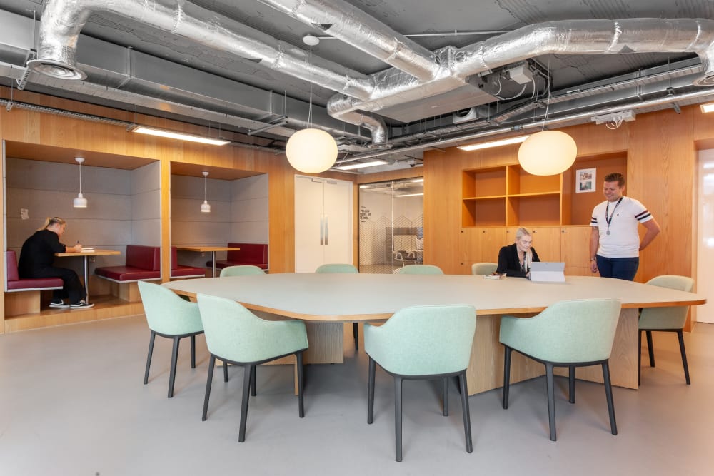 Modern meeting space with oval table for collaboration at Virtual Office Solutions.