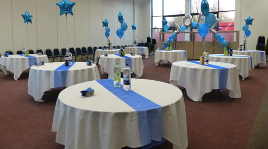 Speedwell Room event space with round tables, ideal for networking and celebrations.