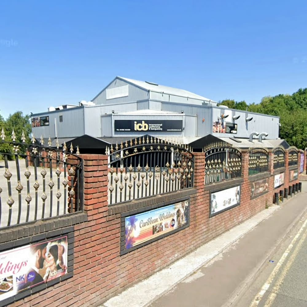 Modern banquet hall exterior with signage, ideal for events and conferences.