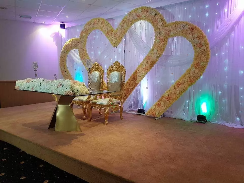 ICB-Balcony Suite with heart floral backdrop, ideal for weddings and celebrations.