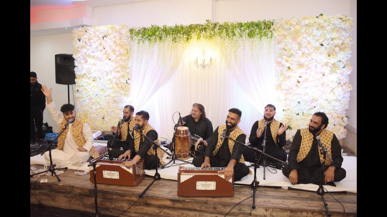 Live music performance at Excalibur Grand with floral backdrop, perfect for weddings and events.