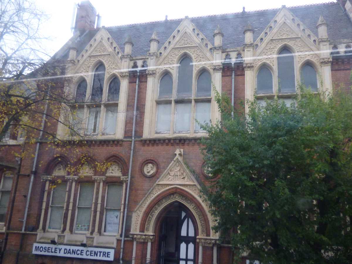 Historic Moseley Dance Centre Main Hall with intricate architecture, perfect for elegant events.