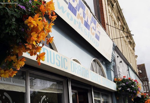 Vibrant Moseley Dance Centre entrance with flowers, perfect for creative events and workshops.