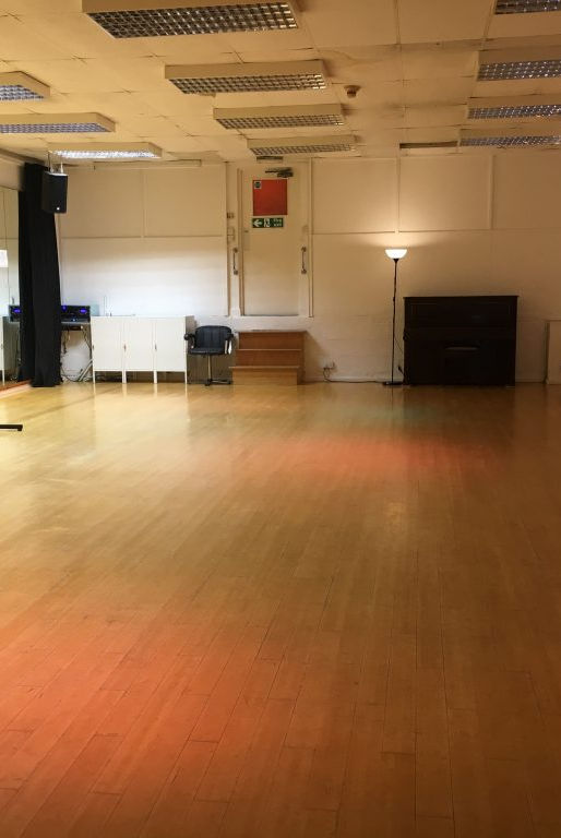 Versatile event space with polished wooden floor at Moseley Dance Centre for workshops and meetings.