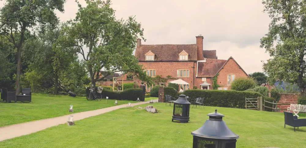 Bishops Barn wedding venue with lush greenery, perfect for outdoor events and gatherings.