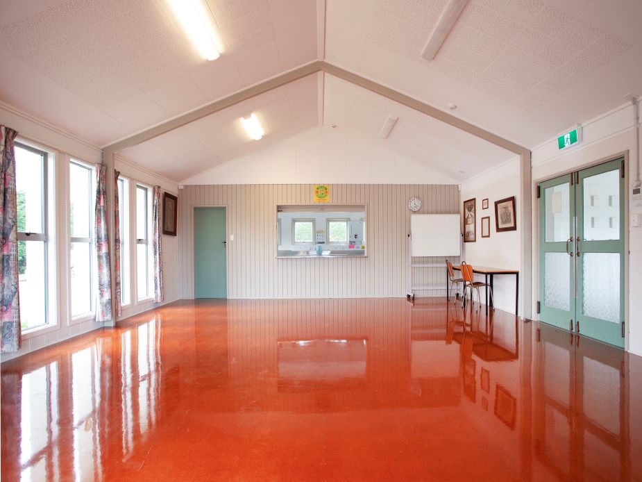 Versatile meeting room with natural light, ideal for workshops and gatherings at The Oaks Community Hall.