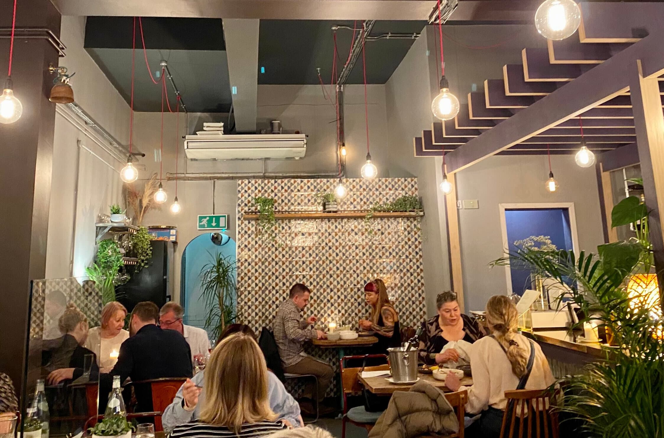 Vibrant dining space in Verbena, ideal for intimate gatherings and networking events.