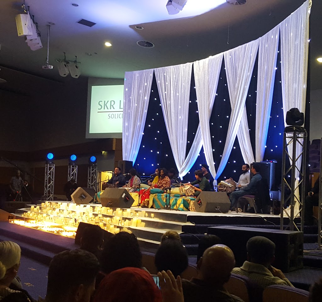 Main auditorium at Bethel Convention Centre, elegant stage for corporate events and discussions.