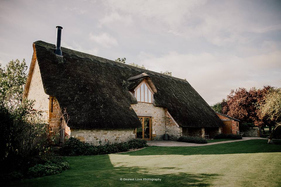 16th Century thatched-roof barn at Blackwell Grange, perfect for weddings and events.