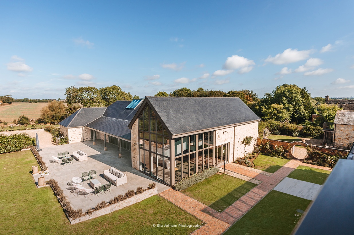 Modern wedding ceremony room at Blackwell Grange with large windows and scenic views.