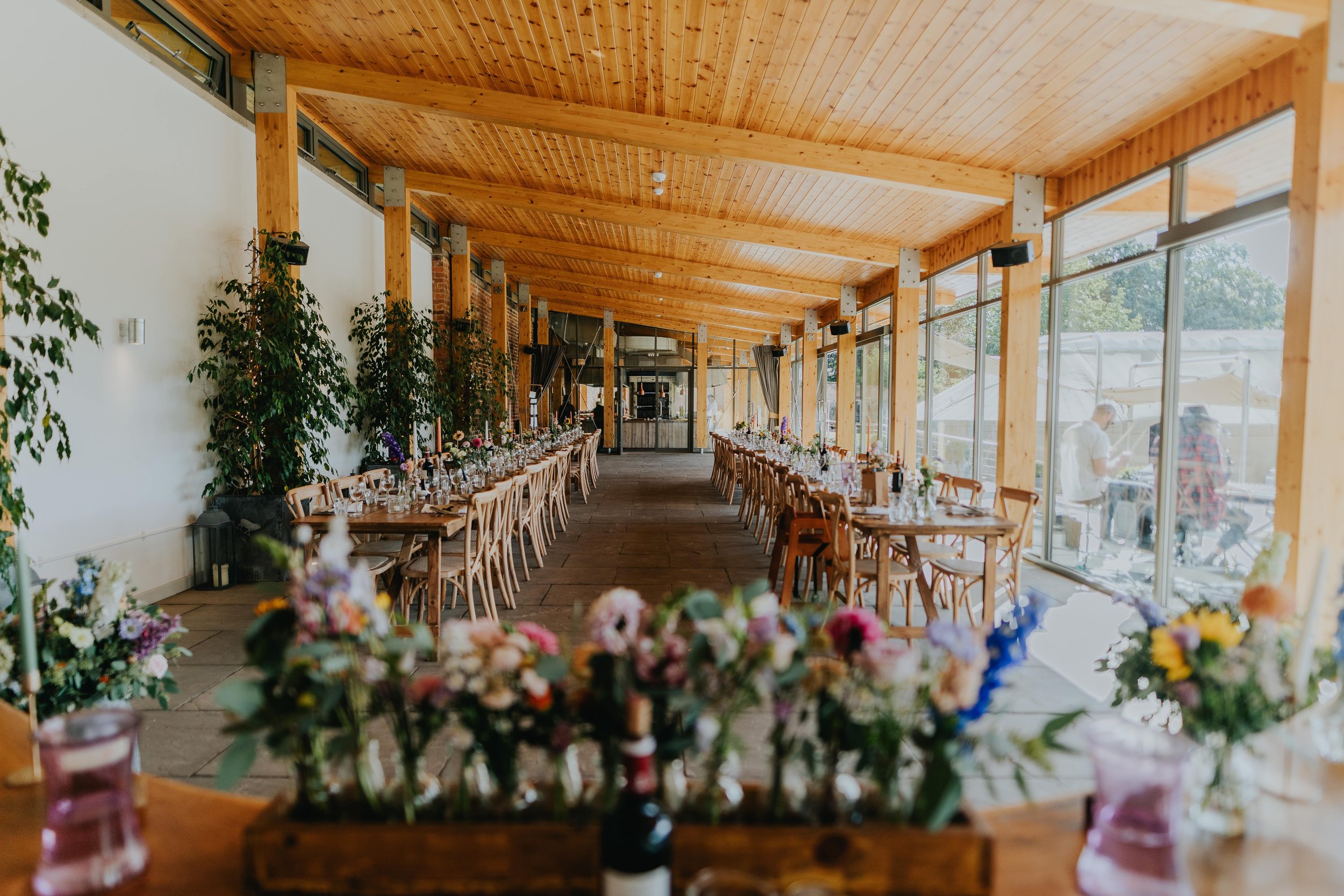 Ceremony Room in Thorpe Garden with floral centerpieces, perfect for weddings and retreats.