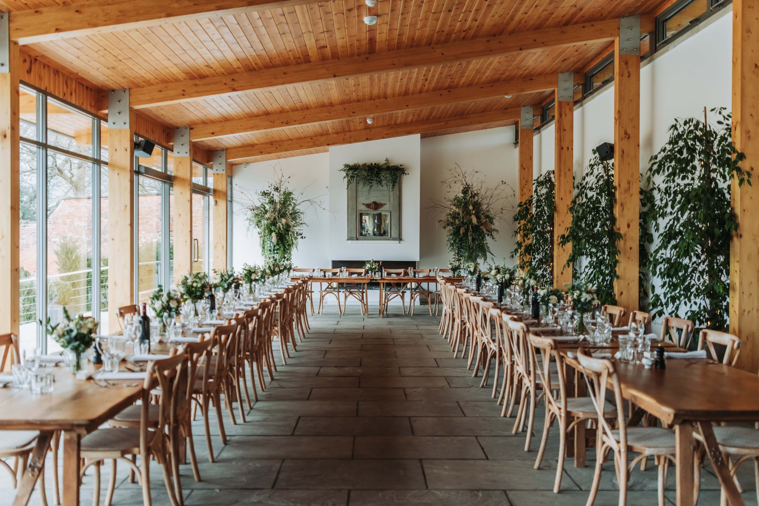 Ceremony Room in Thorpe Garden with elegant tables for events and natural light.
