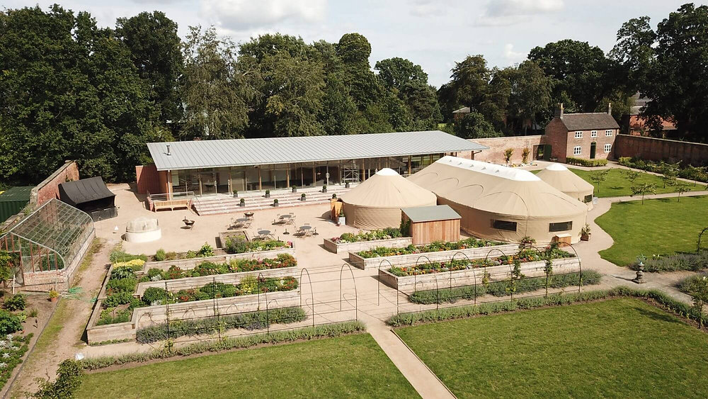 Yurt venue in Thorpe Garden, ideal for events and meetings with serene landscaping.