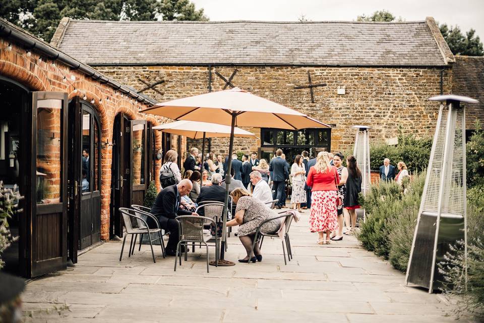 Mezzanine Bar outdoor event space with umbrellas for networking and social gatherings.