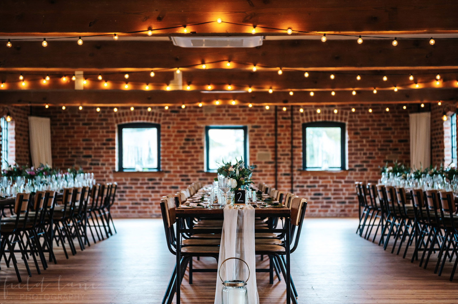 Event space in Haarlem Mill with long tables, ideal for weddings and corporate gatherings.