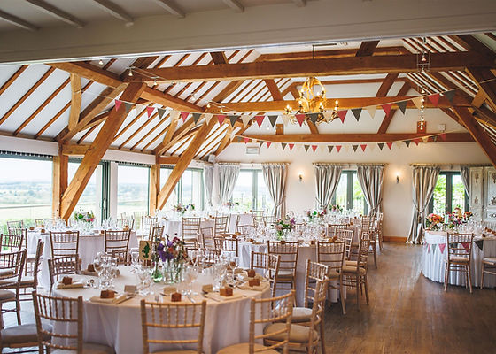 Elegant Bredon Room event space with round tables, ideal for weddings and gatherings.
