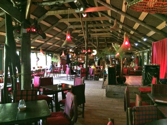 Vibrant Akamba Venue gardens with rustic charm, ideal for events and gatherings.