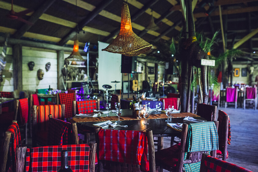 "Akamba Bar & Eatery: cozy event space with rustic decor for intimate gatherings and themed dinners."