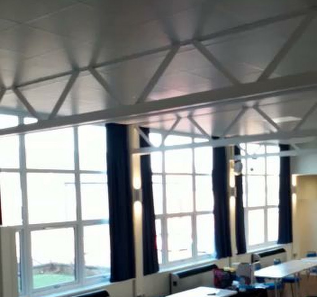 Spacious B12 Urban Village Hall with large windows, ideal for meetings and conferences.