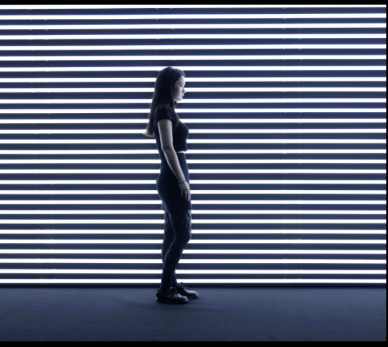 Sleek Elipse venue with striped backdrop, ideal for product launches and fashion events.