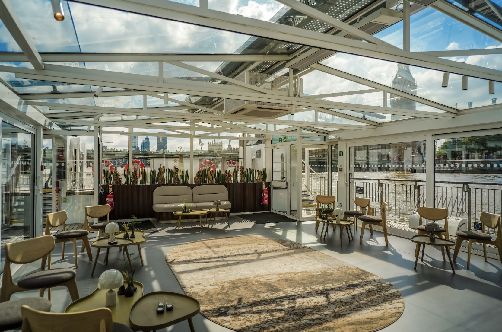 Bright event space with large windows, ideal for networking and meetings.